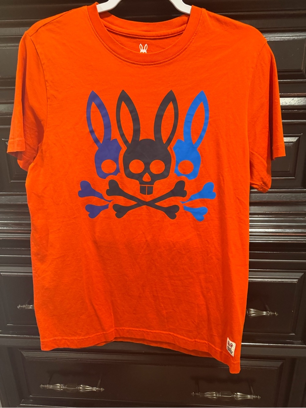 Psycho Bunny Orange Tee with Blue & Black Bunny Skull Graphic